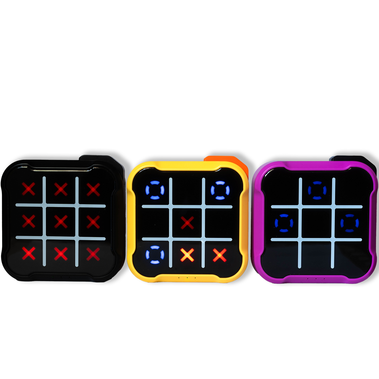 Three electronic Tic Tac Toe game boards in yellow, black, and purple, powered on with lights glowing