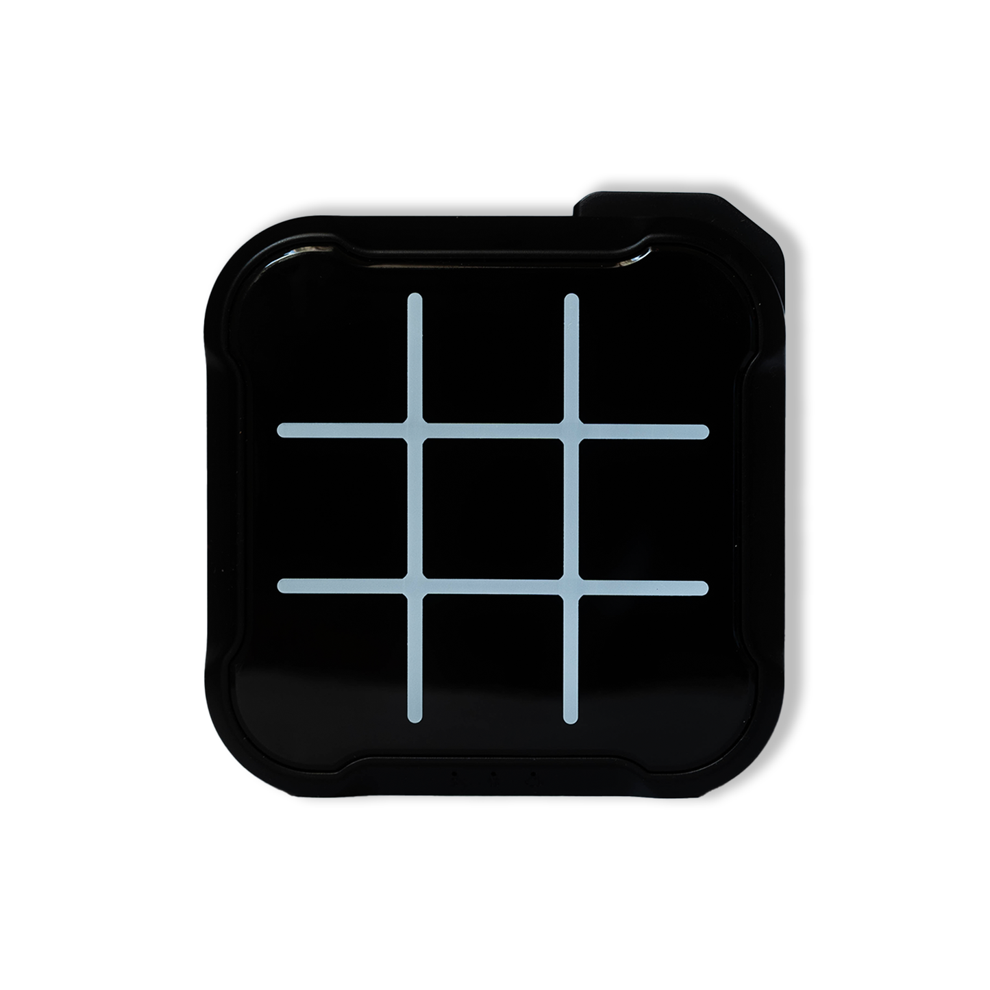 Electronic Tic Tac Toe game board in black color, powered off with unlit lights